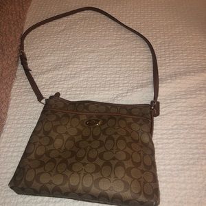 Coach Brown and tab cross body bag.